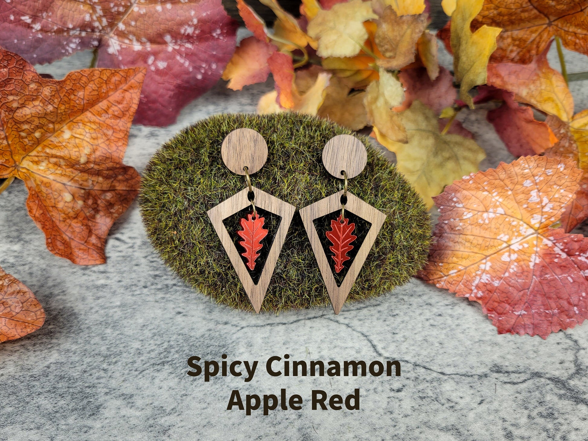 Diamond-shaped walnut wood earrings with metallic acrylic oak leaf dangle in fall colors - apple red front view