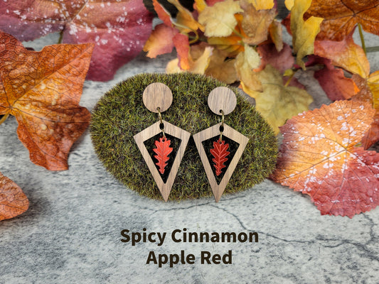 Diamond-shaped walnut wood earrings with metallic acrylic oak leaf dangle in fall colors - apple red front view