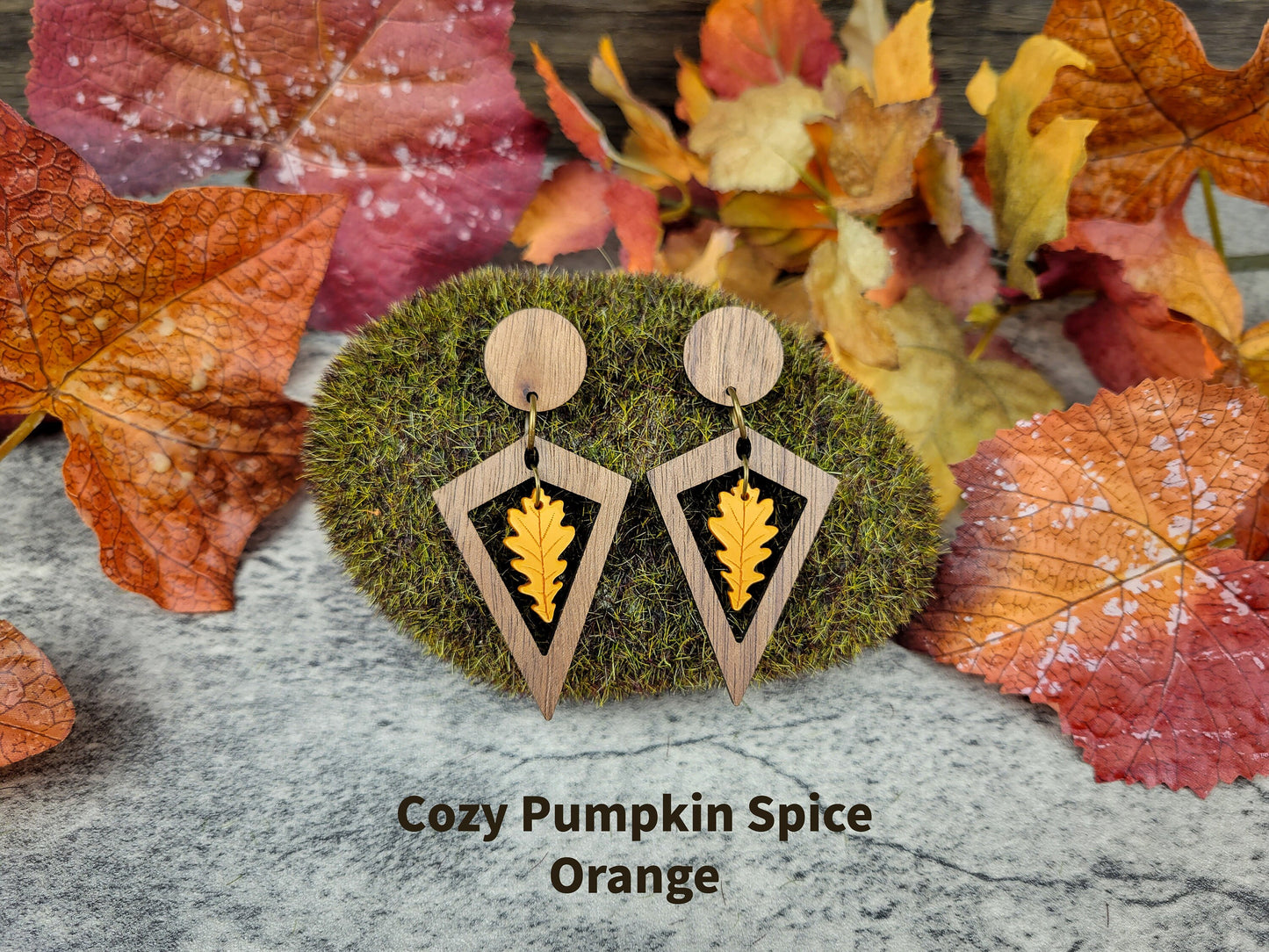 Diamond-shaped walnut wood earrings with metallic acrylic oak leaf dangle in fall colors - pumpkin spice front view