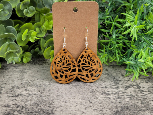 Lightweight botanical teardrop earrings made of laser-cut birch wood with sterling silver-plated hooks – front view