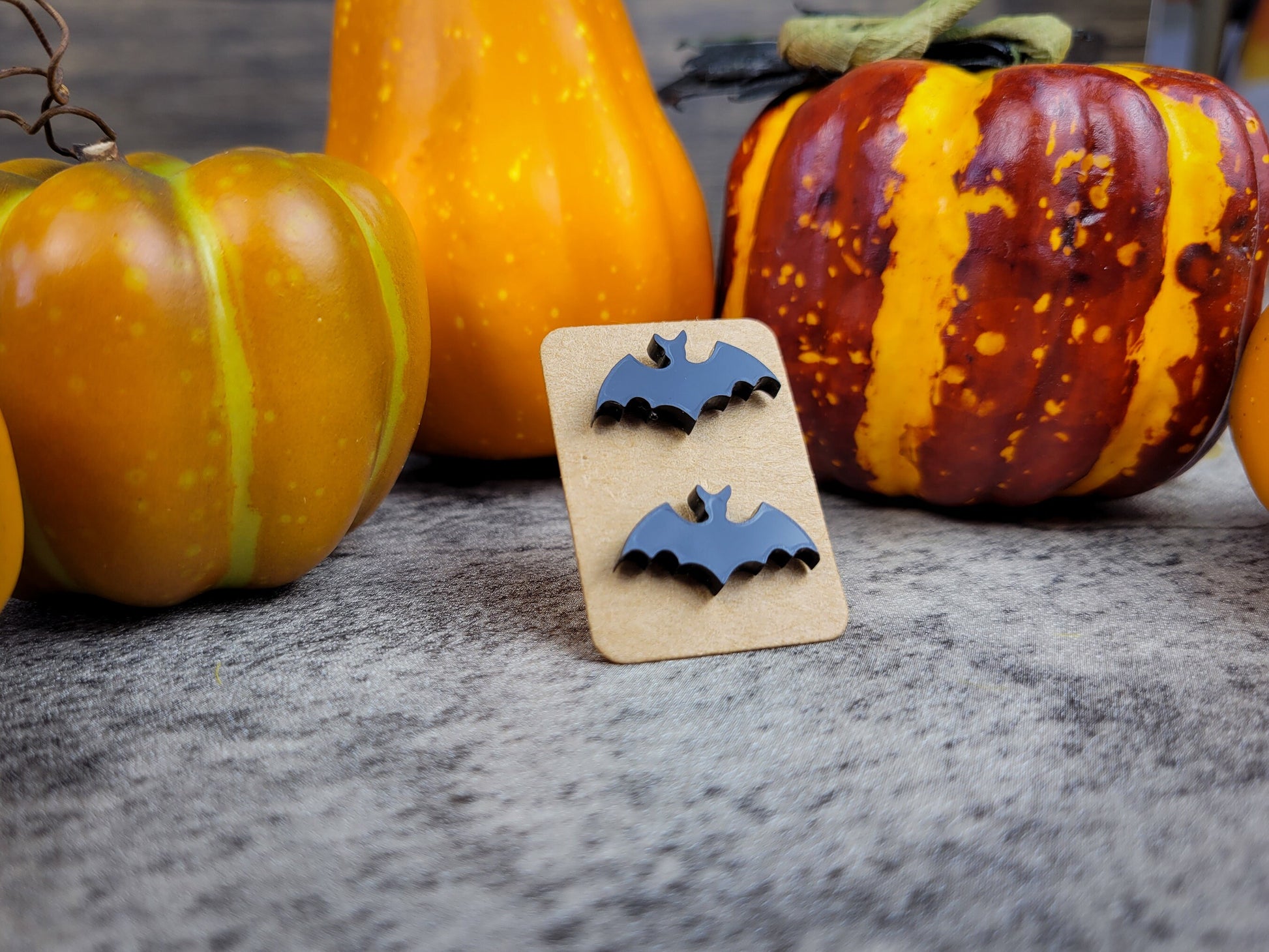 Halloween jewelry collection with bat earrings angled view