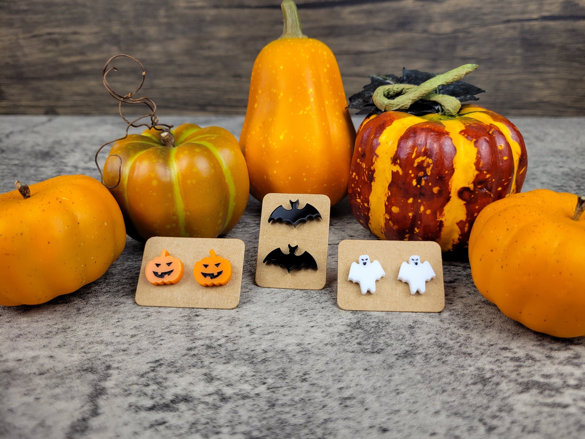 Halloween jewelry collection with ghost, bat, and pumpkin earrings front view