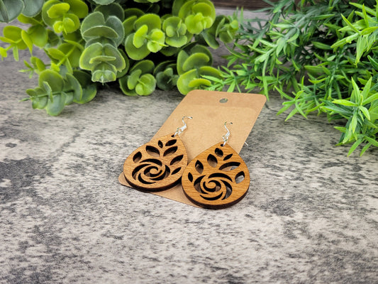 Laser-cut rose teardrop dangle earrings made of birch wood on silver-plated hooks – flat angle view