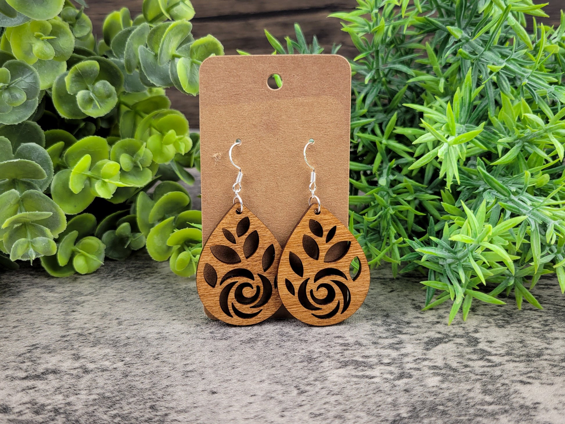 Laser-cut rose teardrop dangle earrings made of birch wood on silver-plated hooks – front view