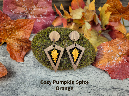 Diamond-shaped walnut wood earrings with metallic acrylic oak leaf dangle in fall colors - pumpkin spice front view
